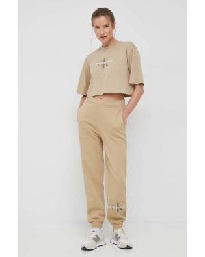 Calvin Klein Jeans spodnie dresowe damskie kolor beżowy z nadrukiem