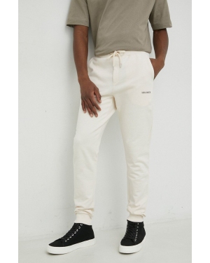 Les Deux spodnie dresowe bawełniane kolor beżowy z nadrukiem