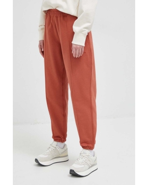New Balance spodnie dresowe bawełniane kolor czerwony gładkie