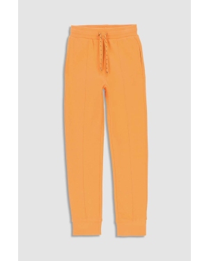 Coccodrillo spodnie dresowe bawełniane dziecięce kolor pomarańczowy gładkie