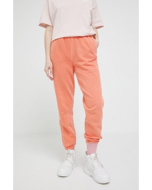 Superdry spodnie dresowe bawełniane kolor pomarańczowy gładkie