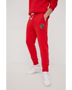 Superdry spodnie dresowe męskie kolor czerwony z aplikacją