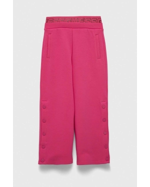 Guess spodnie dresowe dziecięce kolor różowy gładkie