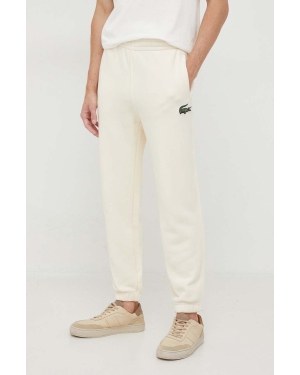 Lacoste spodnie dresowe bawełniane kolor beżowy gładkie