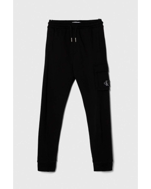 Calvin Klein Jeans spodnie dresowe bawełniane dziecięce kolor czarny gładkie