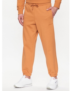 New Balance Spodnie dresowe MP23551 Pomarańczowy Relaxed Fit