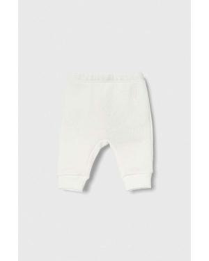 United Colors of Benetton spodnie dresowe bawełniane niemowlęce kolor biały melanżowe