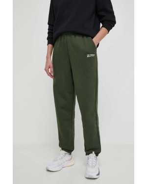 New Balance spodnie dresowe kolor zielony gładkie WP33513KOU