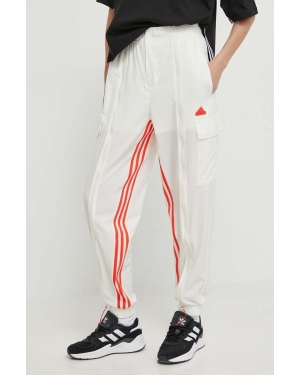 adidas spodnie dresowe kolor beżowy z aplikacją IS0904