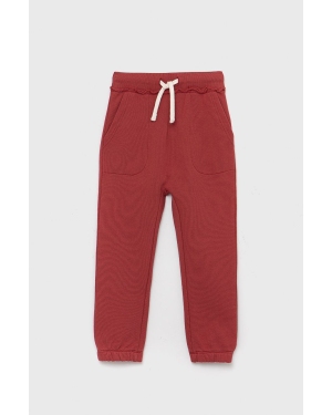 United Colors of Benetton spodnie dresowe bawełniane dziecięce kolor czerwony gładkie