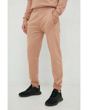 Arkk Copenhagen spodnie dresowe bawełniane unisex kolor beżowy gładkie
