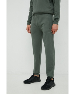 Arkk Copenhagen spodnie dresowe bawełniane unisex kolor zielony gładkie