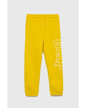 GAP spodnie dresowe dziecięce kolor żółty z nadrukiem