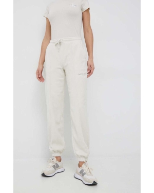 Calvin Klein Jeans spodnie dresowe damskie kolor beżowy z aplikacją